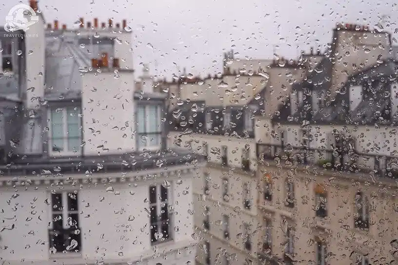 4. Raindrops forming on the window outside a hotel in Paris