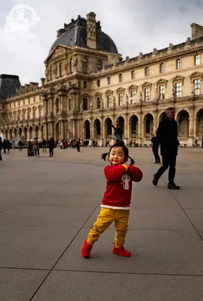 child in front of Paris, France