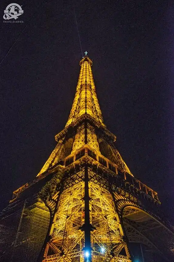 Eiffel Tower lit up at night; Paris, France
