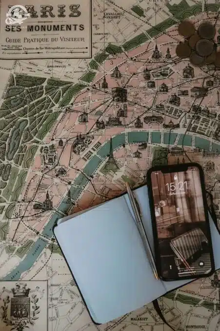 smartphone on white map of Paris